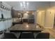 Lovely kitchen featuring dark cabinets, granite countertops, and modern appliances at 5054 Avenida Del Sol Dr, Raleigh, NC 27616