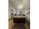 Open-concept living room with hardwood floors, vaulted ceilings, and a fireplace at 5054 Avenida Del Sol Dr, Raleigh, NC 27616