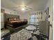 Spacious main bedroom with ample natural light, a ceiling fan, and stylish décor at 5054 Avenida Del Sol Dr, Raleigh, NC 27616