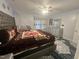 Well-appointed main bedroom with modern furnishings, plush bedding, and elegant accents at 5054 Avenida Del Sol Dr, Raleigh, NC 27616