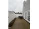 A quaint patio featuring a white fence, ideal for outdoor dining and relaxation at 5054 Avenida Del Sol Dr, Raleigh, NC 27616