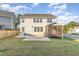 View of the home's backyard, featuring a screened in porch and patio, offering space for relaxation at 5072 Aspen Meadow St, Raleigh, NC 27616
