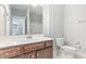 Cozy bathroom featuring wood cabinets, a white counter, and a classic commode at 5072 Aspen Meadow St, Raleigh, NC 27616