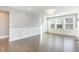 Bright, spacious living area showcasing hardwood floors, wainscoting, and an abundance of natural light at 5072 Aspen Meadow St, Raleigh, NC 27616