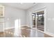 Eat-in kitchen featuring sliding door access to a screened-in porch at 5072 Aspen Meadow St, Raleigh, NC 27616