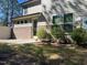Enjoy this lovely outdoor space with a patio, shrubbery and well manicured lawn at 525 Rockcastle Dr, Cary, NC 27519