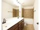 Bathroom featuring double sinks, tile floors, and tiled shower and bath at 525 Rockcastle Dr, Cary, NC 27519