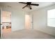 Bright bedroom featuring a ceiling fan, plush carpet, and lots of natural light at 525 Rockcastle Dr, Cary, NC 27519