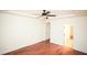 Bedroom featuring hardwood floors, ceiling fan, and natural light at 525 Rockcastle Dr, Cary, NC 27519