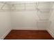 Walk-in closet with hardwood flooring and wire shelving at 525 Rockcastle Dr, Cary, NC 27519