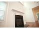 Living room fireplace shows hardwood floors, natural light, and flows into an open layout at 525 Rockcastle Dr, Cary, NC 27519