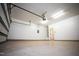 Bright and spacious two car garage featuring neutral painted walls and sealed concrete floors at 525 Rockcastle Dr, Cary, NC 27519