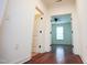 Bright hallway with hardwood floors and white trim leads to bedroom at 525 Rockcastle Dr, Cary, NC 27519