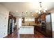 Beautiful kitchen features stainless steel appliances, a center island, and a stylish pendant lighting at 525 Rockcastle Dr, Cary, NC 27519