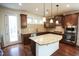 Well-appointed kitchen with stainless steel appliances, a large island, and access to the backyard at 525 Rockcastle Dr, Cary, NC 27519