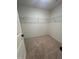 Bright, carpeted walk-in closet with ample storage space and wire shelving at 525 Rockcastle Dr, Cary, NC 27519