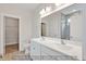 Bathroom featuring double sink vanity, large mirror, and tile shower at 5344 Salem Woods Dr # 20, Graham, NC 27253