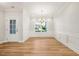 Bright dining room with hardwood floors and elegant crown molding at 5344 Salem Woods Dr # 20, Graham, NC 27253