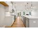 Spacious kitchen with white cabinets, a kitchen island, and modern appliances at 5344 Salem Woods Dr # 20, Graham, NC 27253