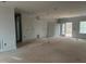 Unfinished living room featuring white trim, fireplace, and sliding glass doors at 5344 Salem Woods Dr # 20, Graham, NC 27253
