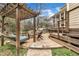 The backyard retreat includes a patio with grill, pergola with swing, and house access at 601 Ballad Creek Ct, Cary, NC 27519