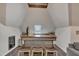 Wet bar area with wood floors, beverage cooler, and bar seating area at 601 Ballad Creek Ct, Cary, NC 27519