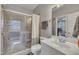 Bathroom features a glass shower, tile floors, and a white vanity with sink at 601 Ballad Creek Ct, Cary, NC 27519