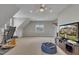 Large bonus room with carpet, natural light, ceiling fan, and media center at 601 Ballad Creek Ct, Cary, NC 27519