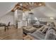 Finished bonus room with wood ceiling, living and office area, bar and seating at 601 Ballad Creek Ct, Cary, NC 27519
