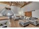 Bonus room with wood floors, a sectional sofa, and a unique ceiling fan at 601 Ballad Creek Ct, Cary, NC 27519