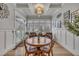 Cozy breakfast nook filled with natural light, with wood floors and a table with four chairs at 601 Ballad Creek Ct, Cary, NC 27519