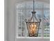 Dining area with a decorative light fixture, windows and trim at 601 Ballad Creek Ct, Cary, NC 27519