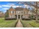 Charming two-story home featuring stone and siding accents, manicured landscaping, and a welcoming front porch at 601 Ballad Creek Ct, Cary, NC 27519