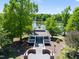Picturesque gazebo by the lake, framed by lush greenery for a serene and inviting outdoor experience at 601 Ballad Creek Ct, Cary, NC 27519