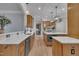 Spacious kitchen featuring custom wood cabinets, countertops, and stainless steel appliances at 601 Ballad Creek Ct, Cary, NC 27519