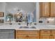 Gourmet kitchen featuring stainless steel appliances, a sink, and stone countertops at 601 Ballad Creek Ct, Cary, NC 27519