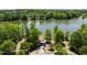 Scenic lake view with a charming gazebo nestled among trees, providing a tranquil community atmosphere at 601 Ballad Creek Ct, Cary, NC 27519