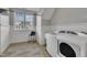 Functional laundry room with washer, dryer, and sink at 601 Ballad Creek Ct, Cary, NC 27519