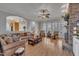 Open-concept living room with fireplace, a view of the staircase, and a lot of natural light at 601 Ballad Creek Ct, Cary, NC 27519