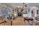 Comfortable living room features a stone fireplace, custom built-ins, and lots of natural light at 601 Ballad Creek Ct, Cary, NC 27519