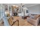 Open-concept living room features a fireplace, neutral paint and views into the kitchen at 601 Ballad Creek Ct, Cary, NC 27519