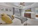 Bright main bedroom with a tray ceiling, TV, and large windows letting in natural light at 601 Ballad Creek Ct, Cary, NC 27519