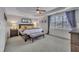 Primary bedroom with tray ceilings, lots of natural light, and neutral colored walls at 601 Ballad Creek Ct, Cary, NC 27519
