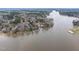 Scenic aerial view of the lake and surrounding homes, highlighting the natural beauty of the area at 651 Sagamore Dr, Louisburg, NC 27549