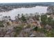 Wide aerial shot of property and the surrounding lake at 651 Sagamore Dr, Louisburg, NC 27549