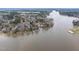 Beautiful aerial view of the property at 651 Sagamore Dr Louisburg with lake access and wooded surroundings at 651 Sagamore Dr, Louisburg, NC 27549