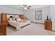 Bright bedroom with large window, neutral carpet, and wood accents at 651 Sagamore Dr, Louisburg, NC 27549