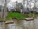 Lake house with a sloping yard to the docks at 651 Sagamore Dr, Louisburg, NC 27549