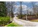 Charming home featuring a long driveway, fenced yard, and lush landscaping at 651 Sagamore Dr, Louisburg, NC 27549