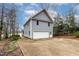 Detached two-story garage with a spacious driveway and well-maintained exterior at 651 Sagamore Dr, Louisburg, NC 27549